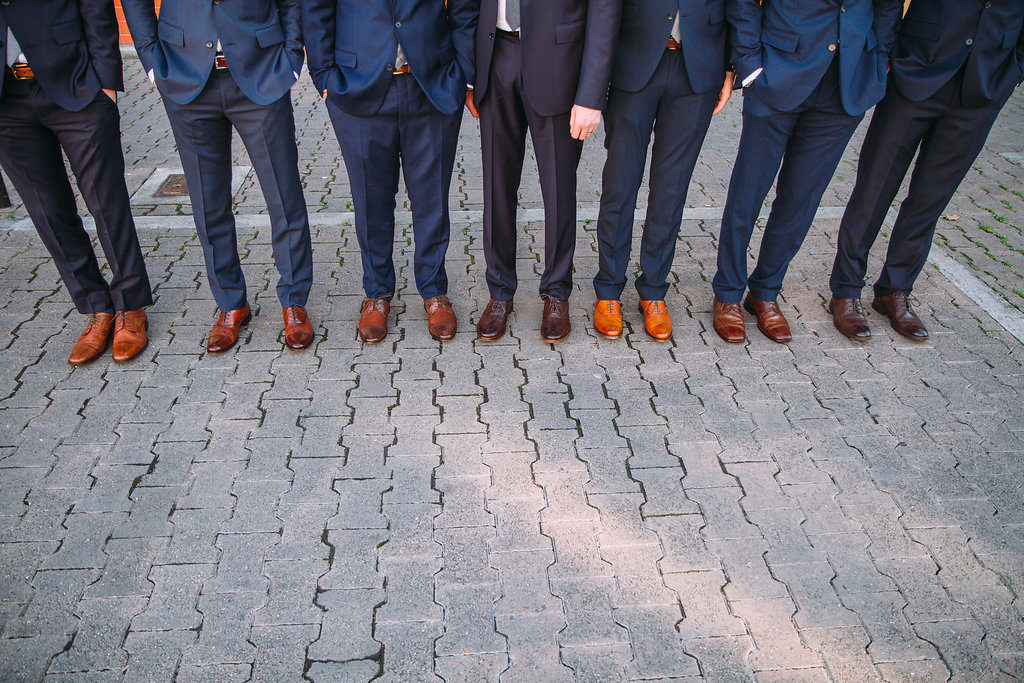 Navy groomsmen suits, brown shoes