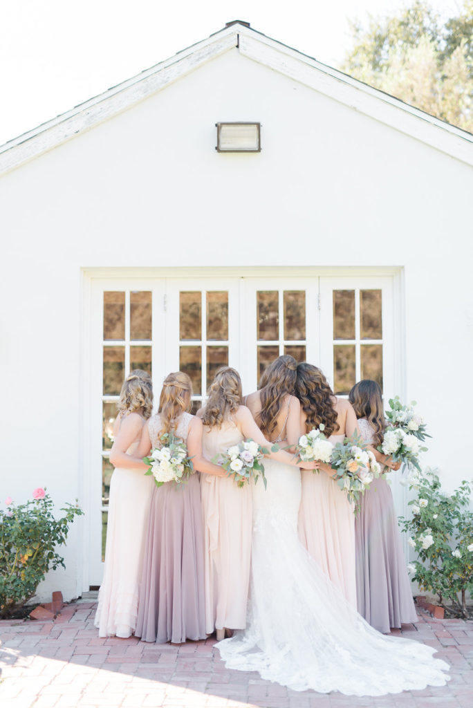 Triunfo creek vineyard wedding bridal party, blush and purple bridesmaid dresses, white flower bouquet