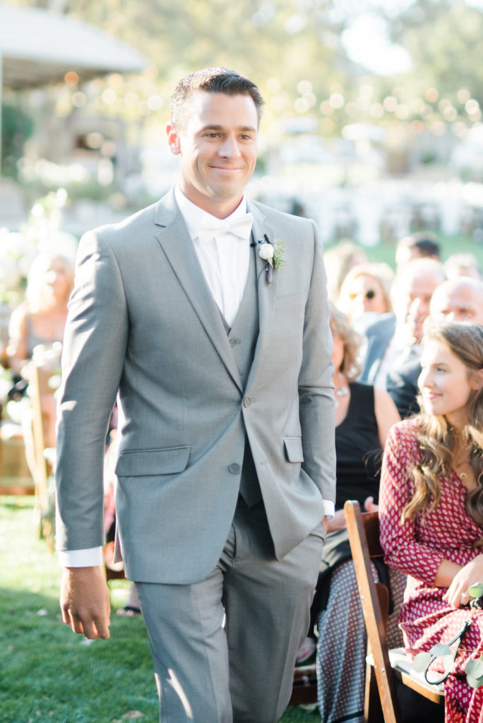 Triunfo creek vineyard wedding ceremony, grey groom suit