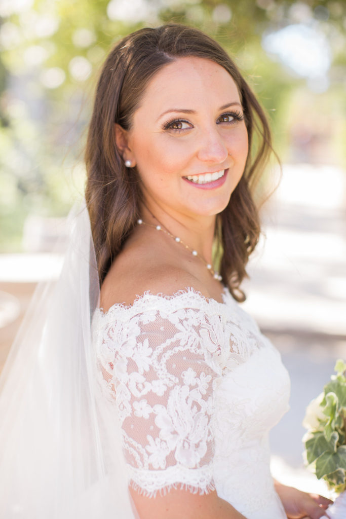 wedding at Sogno del Fiore winery in Santa Ynez, bride portrait shots with all white flower bouquet, bridal hair and make up