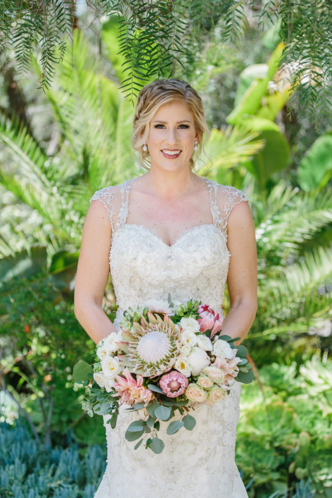 travel themed wedding at Mountain Mermaid, bridal portrait with king protea bouquet