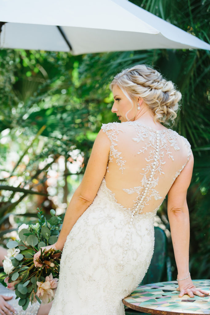 travel themed wedding at Mountain Mermaid, bride with illusion back and button wedding dress
