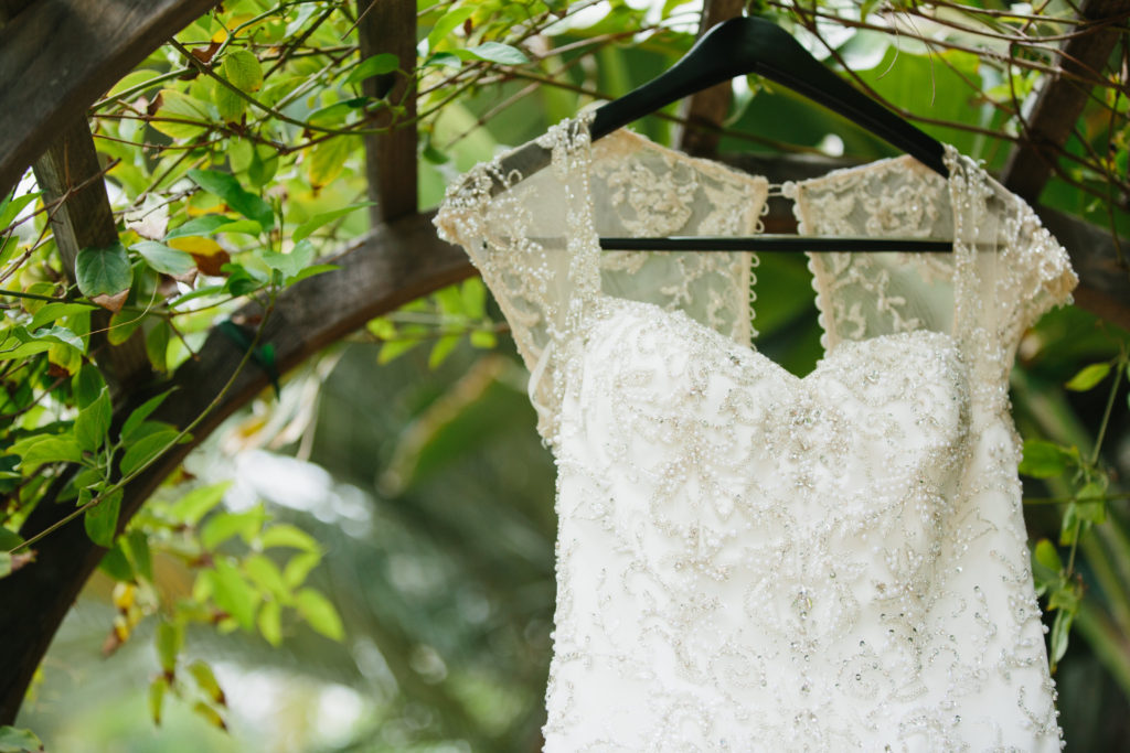 travel themed wedding at Mountain Mermaid, wedding dress with illusion sleeves and beading