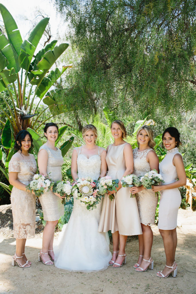 travel themed wedding at Mountain Mermaid, bride and mix matched blush bridesmaid dresses