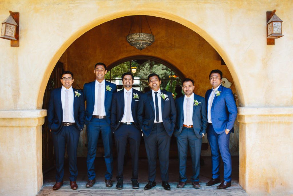 travel themed wedding at Mountain Mermaid, groom and groomsmen in mismatching blue suits
