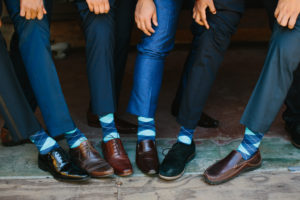 travel themed wedding at Mountain Mermaid, groom and groomsmen in blue socks