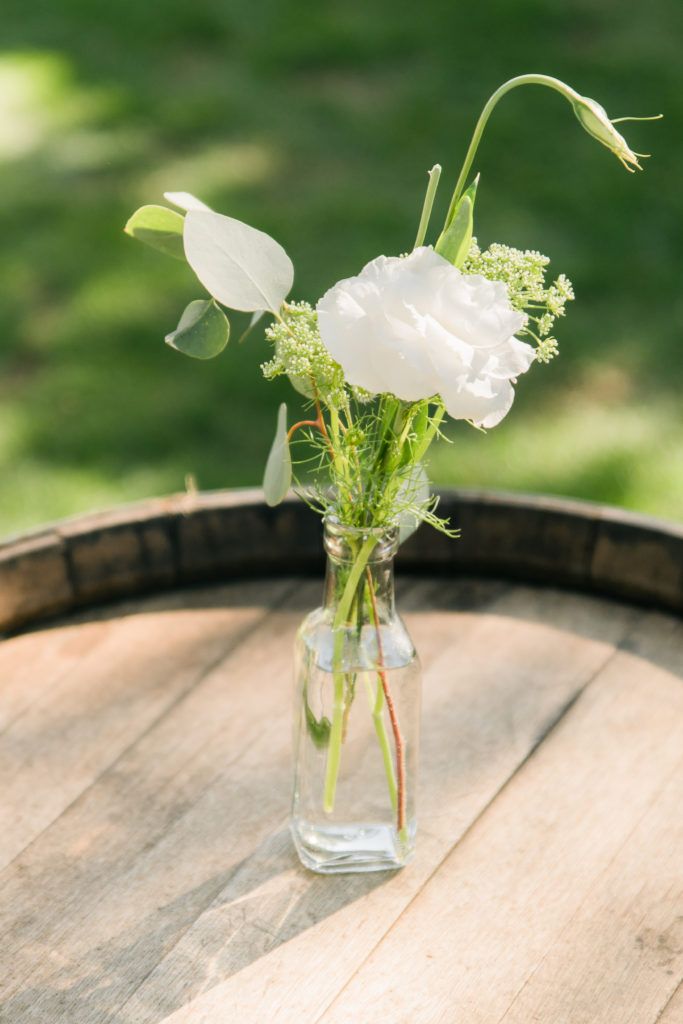 Elegant fall wedding at Triunfo Creek Vineyards, bud vases with white flowers