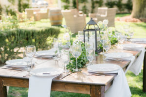 Elegant fall wedding reception at Triunfo Creek Vineyards with white and green florals and lantern