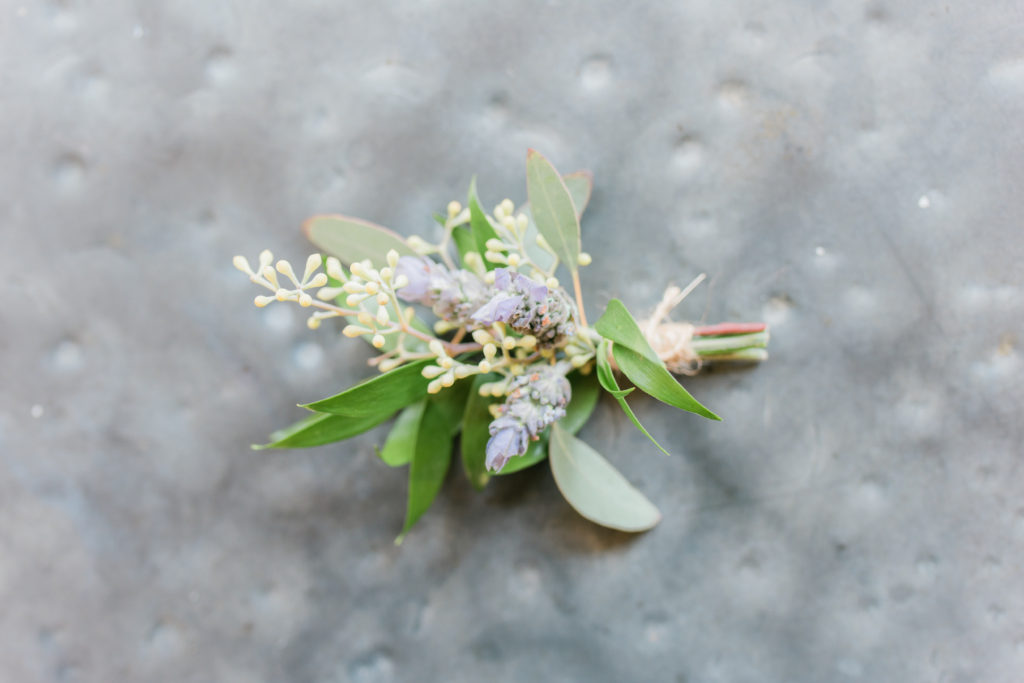 Elegant fall wedding at Triunfo Creek Vineyards, green and white groom boutonniere