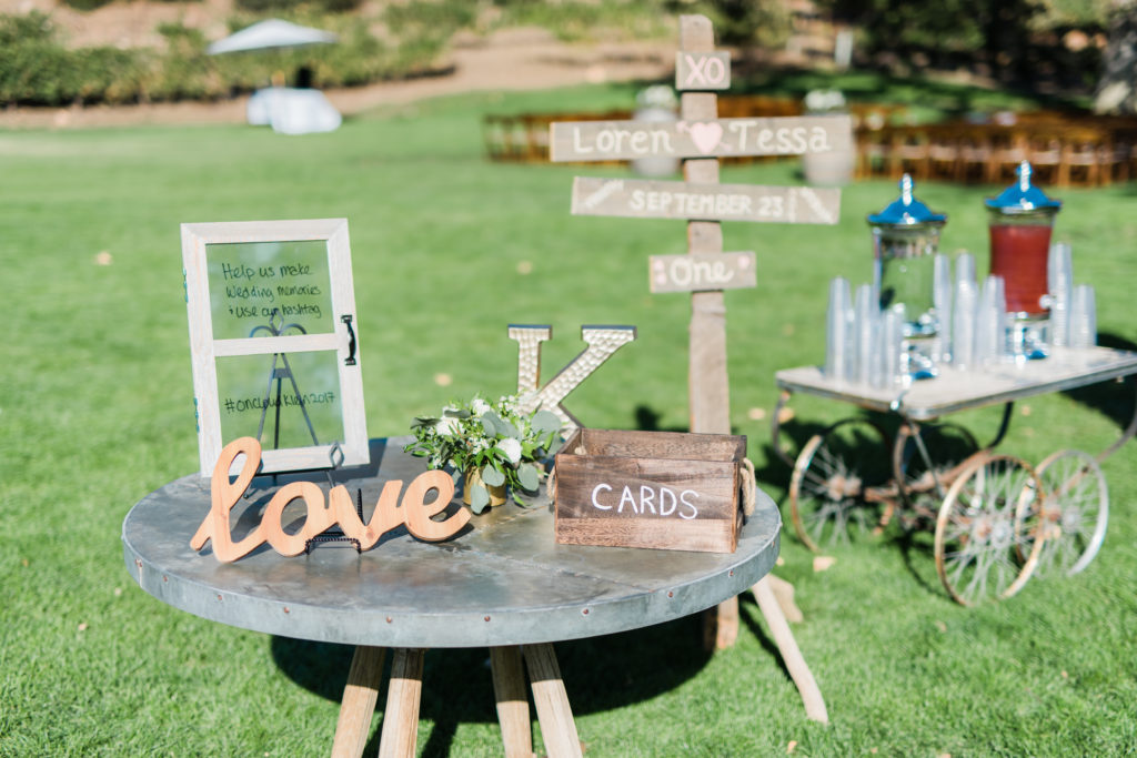Elegant fall wedding ceremony signs at Triunfo Creek Vineyards
