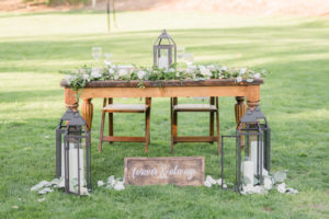 Elegant fall wedding reception sweetheart table at Triunfo Creek Vineyards