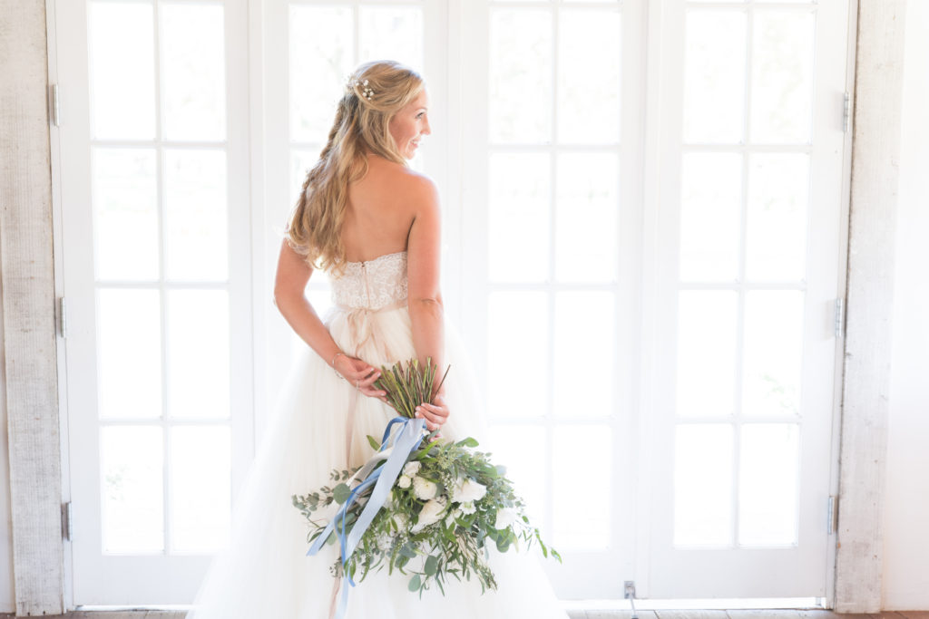 Elegant fall wedding at Triunfo Creek Vineyards, green and white bridal bouquet with blue ribbons