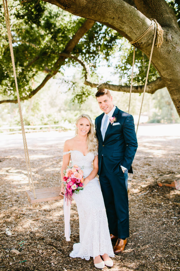 bride and groom wedding portrait on swing at Triunfo Creek Vineyards