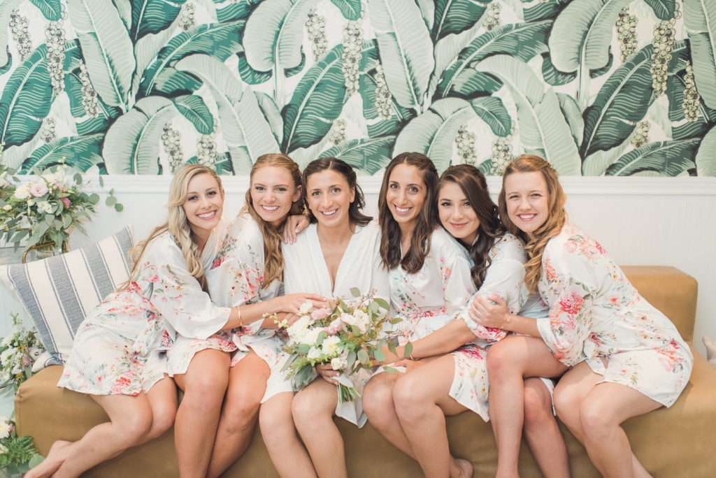 An emotional calamigos ranch wedding, bride and bridesmaids getting ready in robes