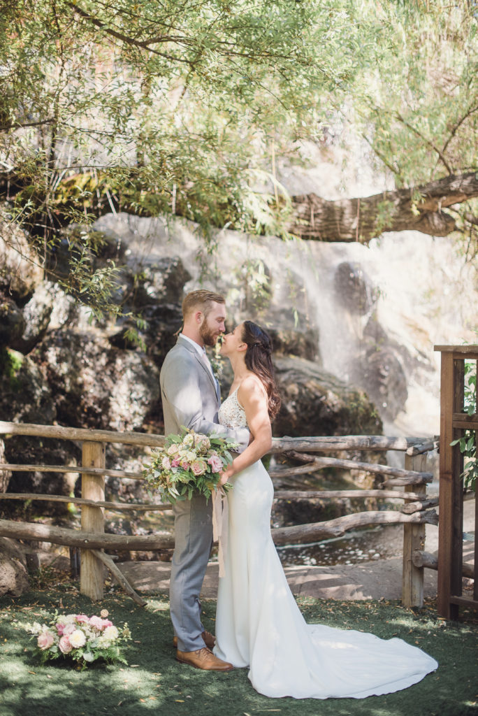 An emotional calamigos ranch wedding, bride and groom waterfall portrait shot