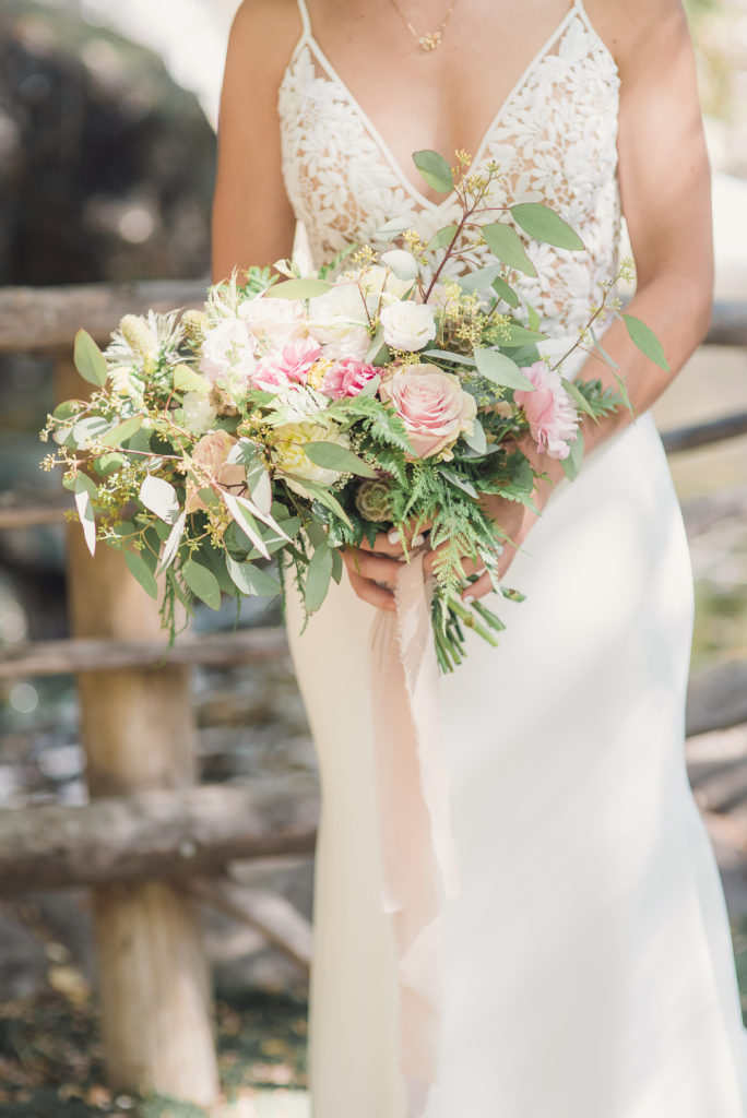 An emotional calamigos ranch wedding, bride with white and pink bridal bouquet