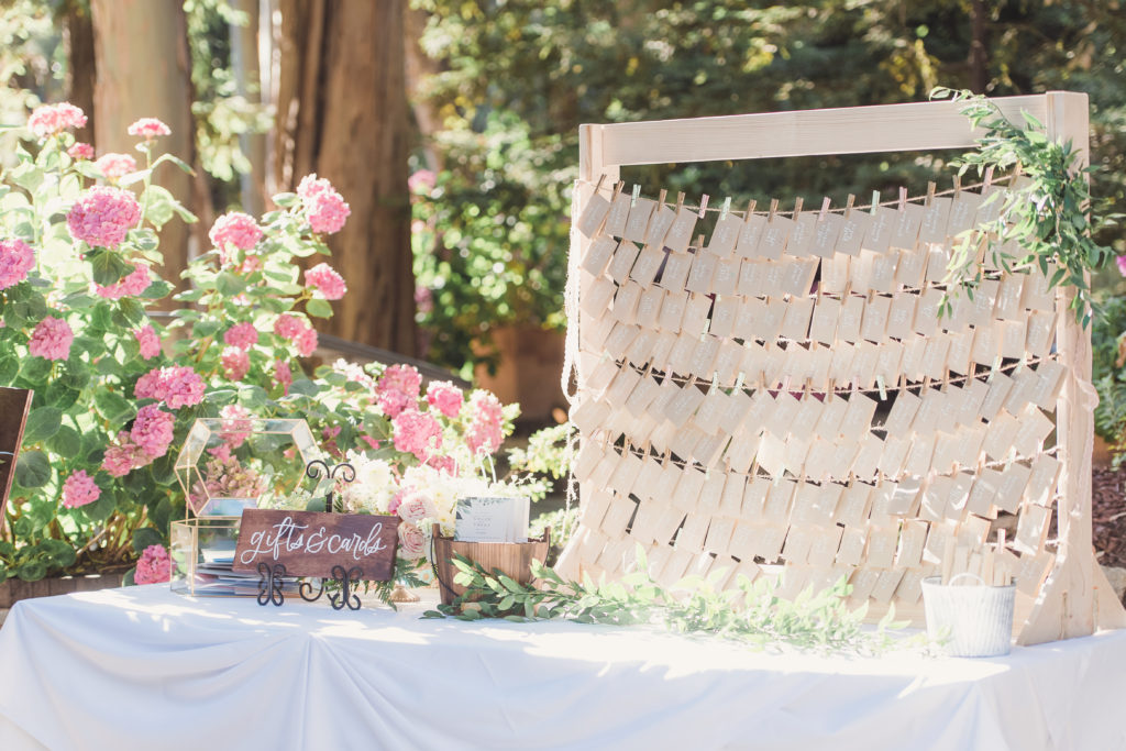 An emotional calamigos ranch wedding, rustic welcome table with escort display