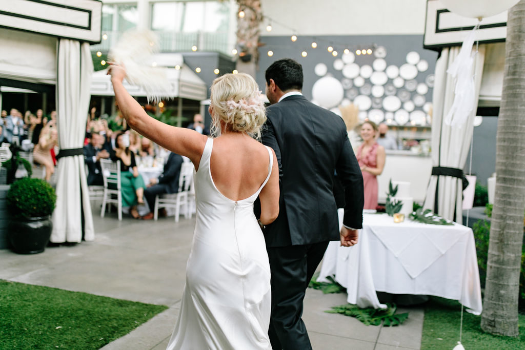 A glam and California infused wedding reception at Viceroy Santa Monica, bride and groom grand entrance