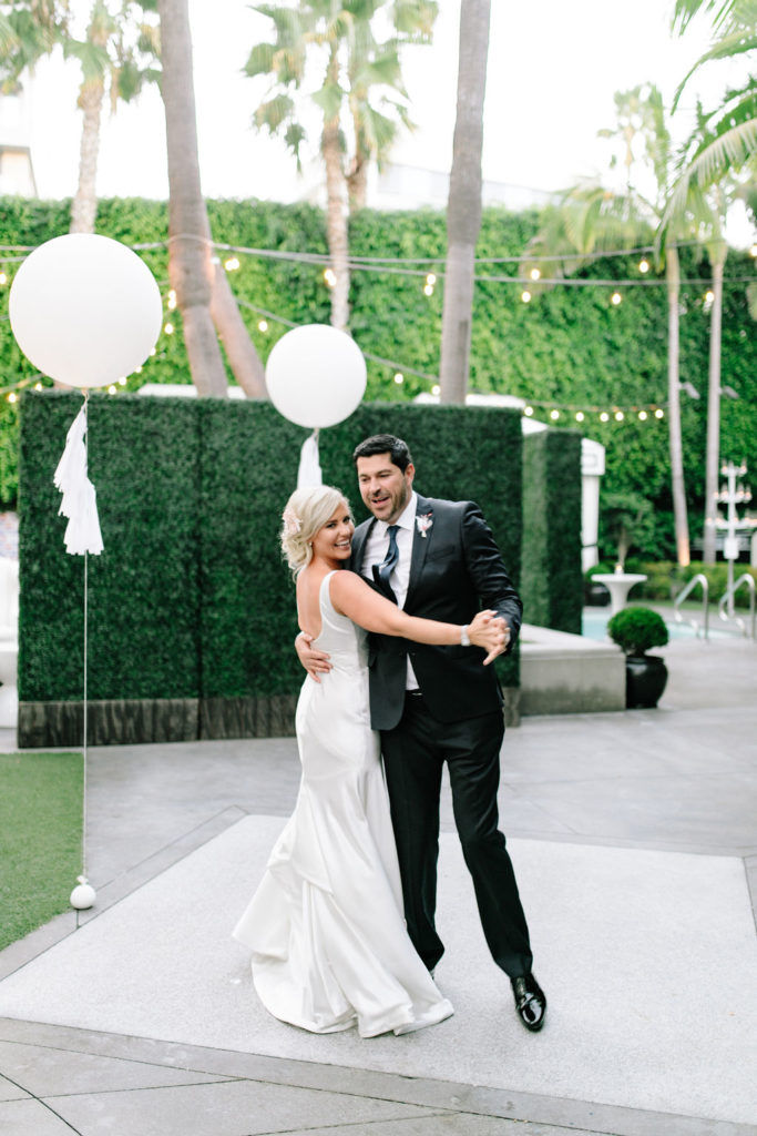 A glam and California infused wedding reception at Viceroy Santa Monica, bride and groom first dance