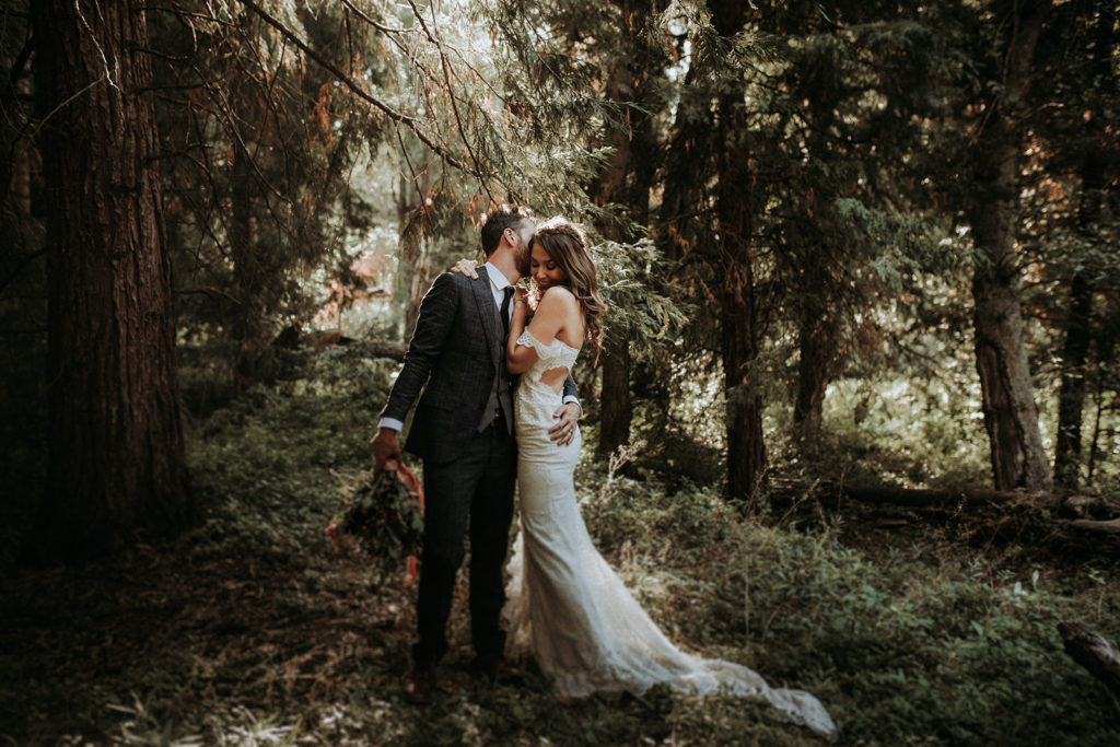 Summer camp themed wedding in Big Bear at Camp Wasegan, bride and groom forest portrait shots