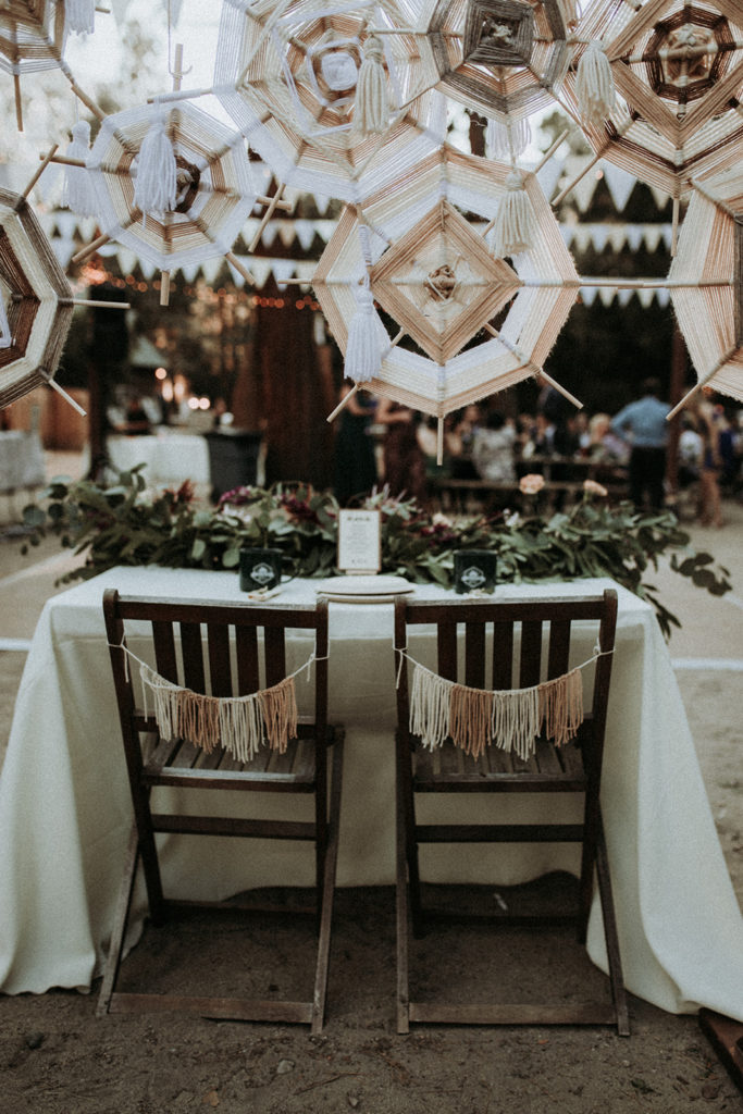 Summer camp themed wedding reception in Big Bear at Camp Wasegan, bohemian sweetheart table