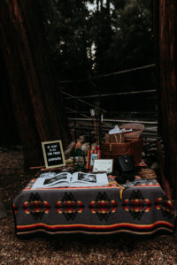 Summer camp themed wedding in Big Bear at Camp Wasegan, rustic bohemian forest themed wedding welcome table