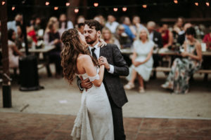 Summer camp themed wedding reception in Big Bear at Camp Wasegan, bride and groom first dance