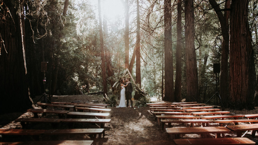 Summer camp themed wedding in Big Bear at Camp Wasegan, bride and groom forest portrait shots