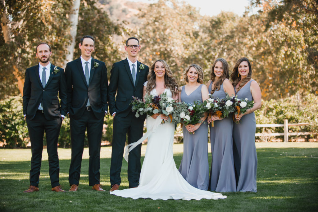 A simple and modern wedding at Triunfo Creek Vineyards, bride and groom with wedding party