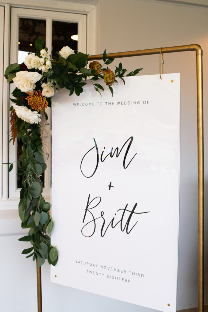 A simple and modern wedding ceremony at Triunfo Creek Vineyards, welcome sign