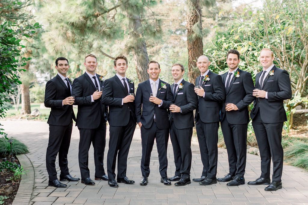 A Romantic Fall Wedding at Maravilla Gardens, groom with groomsmen in dark grey suits