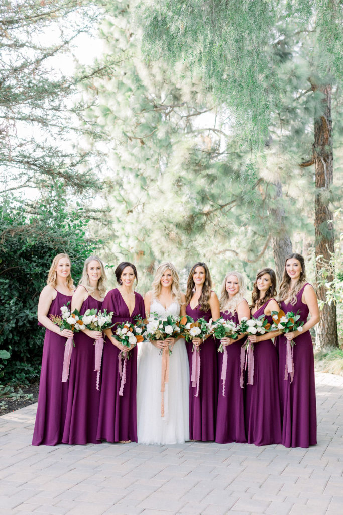 A Romantic Fall Wedding at Maravilla Gardens, bridesmaids in jewel toned dresses