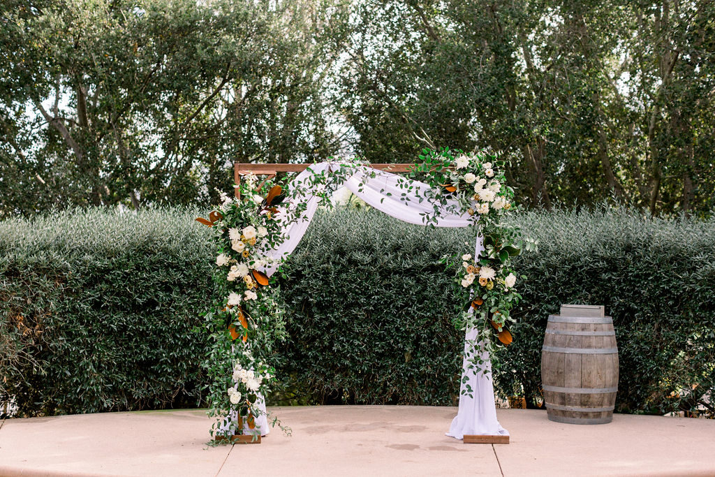 Expert florist advice for weddings, magnolia leaf wedding ceremony arch