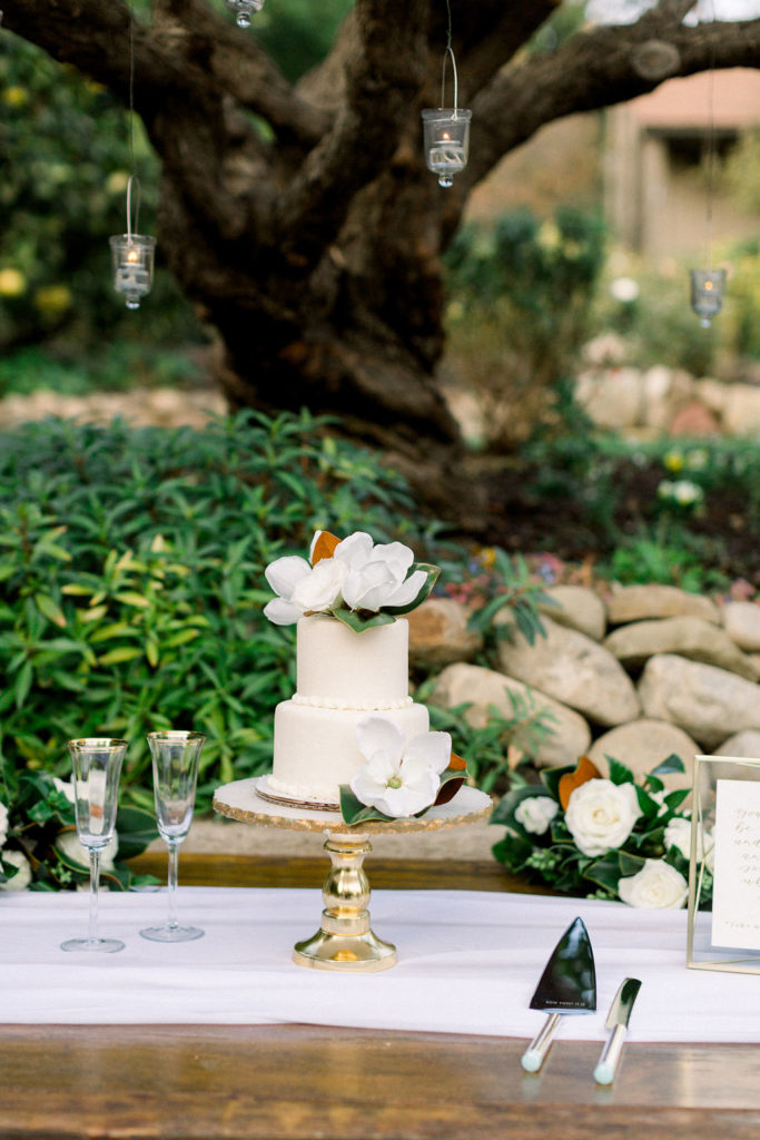 A Romantic Fall Wedding reception at Maravilla Gardens, delicate wedding cake with magnolia leaves