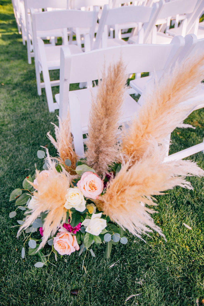 Fall Wedding ceremony at Triunfo Creek Vineyards, aisle flowers with pampas grass