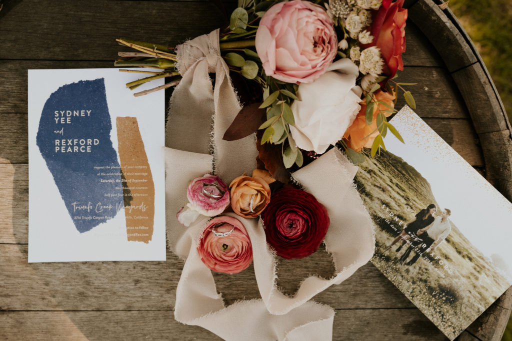 A whimsical wedding at Triunfo Creek Vineyards, blue and beige water color wedding invitation detail shot