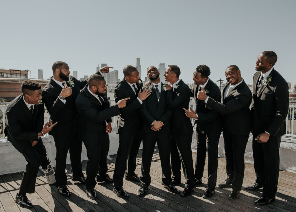 Beautiful wedding at The Unique Space in downtown LA, groomsmen in black suits