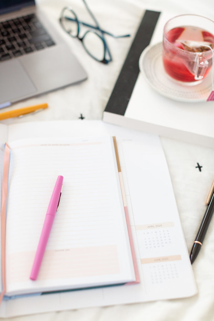 how to book more consultation calls, computer, planner and tea on work desk