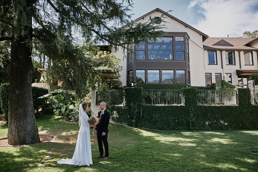 bride and groom first look at the historic Altadena Country Club