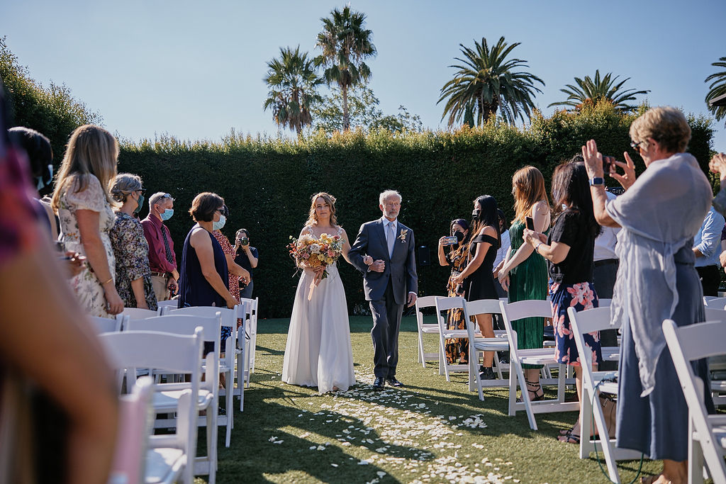 bride walks down the aisle at the Altadena Country Club