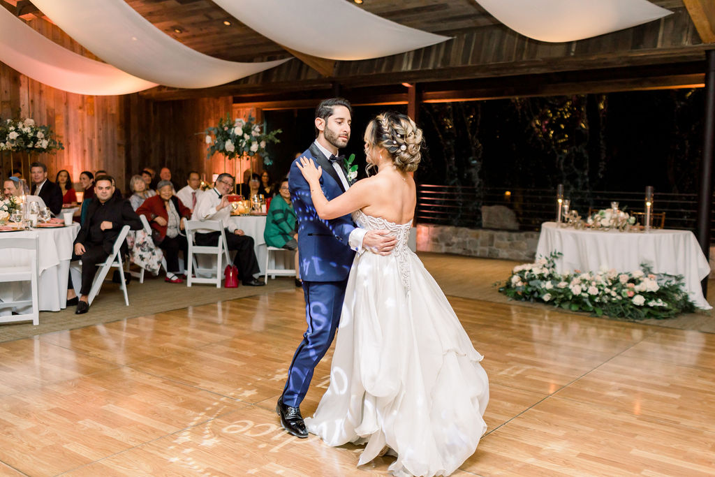 bride and groom first dance during wedding reception at Calamigos Ranch