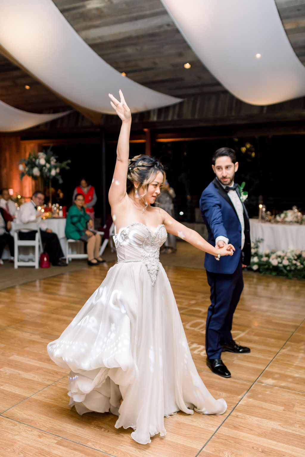 bride and groom first dance at wedding reception 
