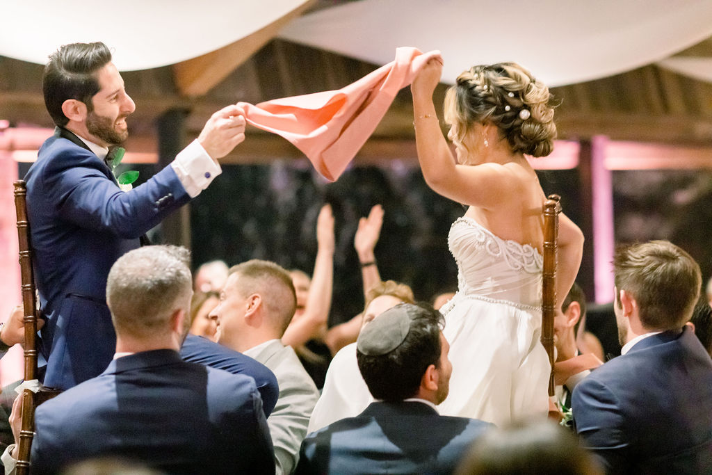 bride and groom hora dance during wedding reception at Calamigos