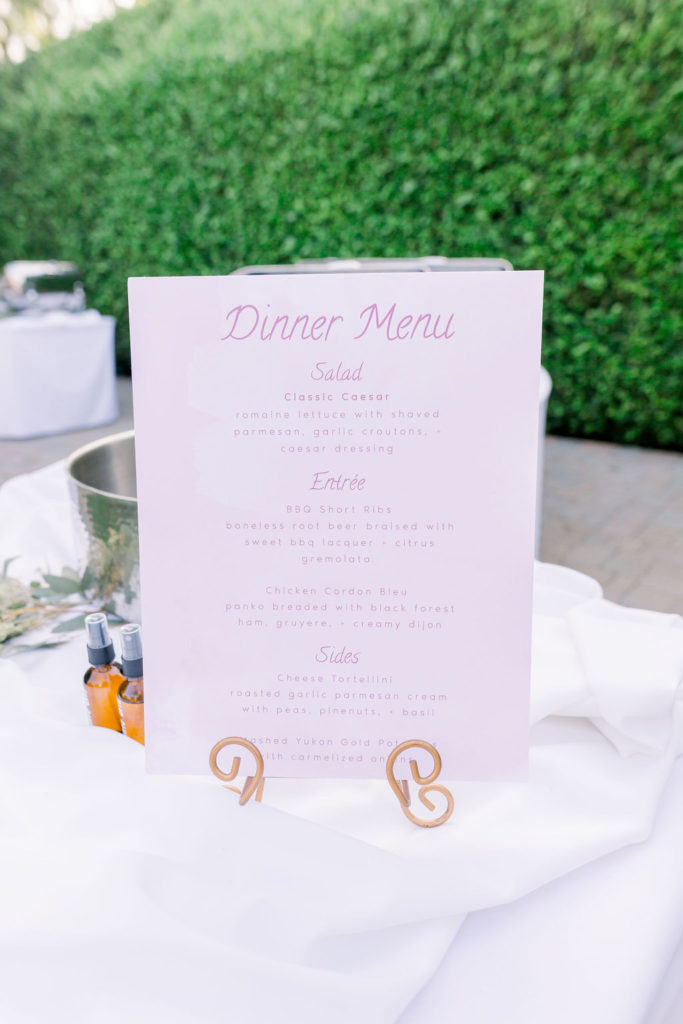 pink dinner menu on display during reception 