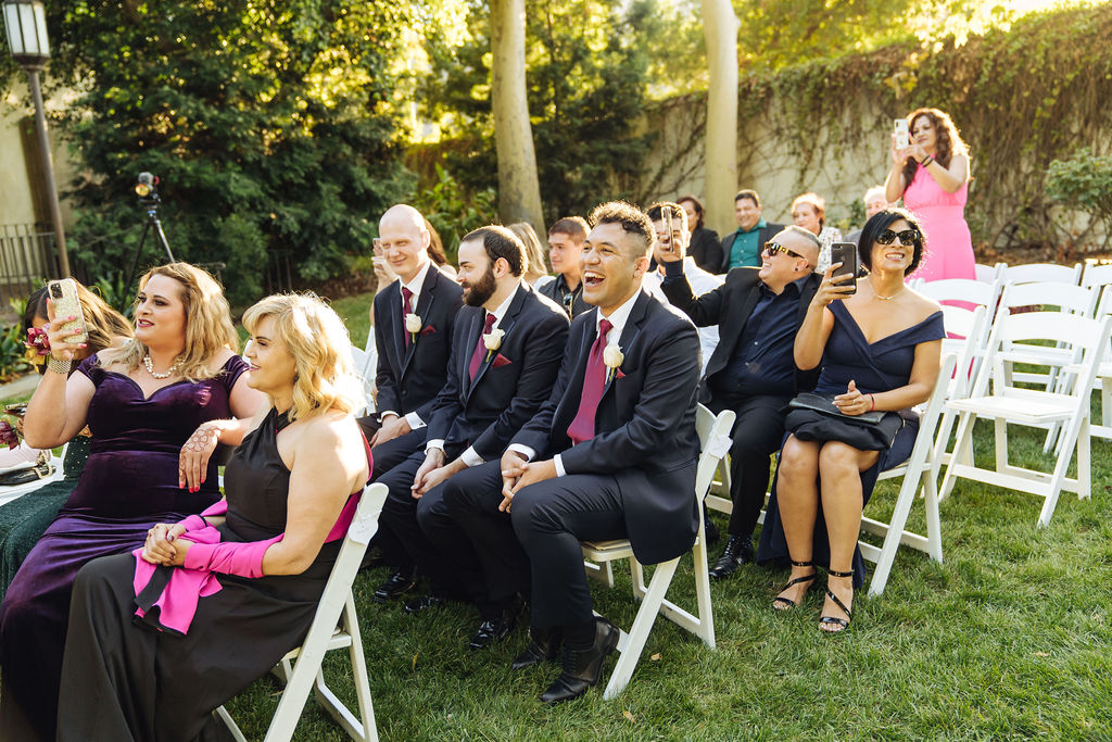 guests laughing during wedding ceremony