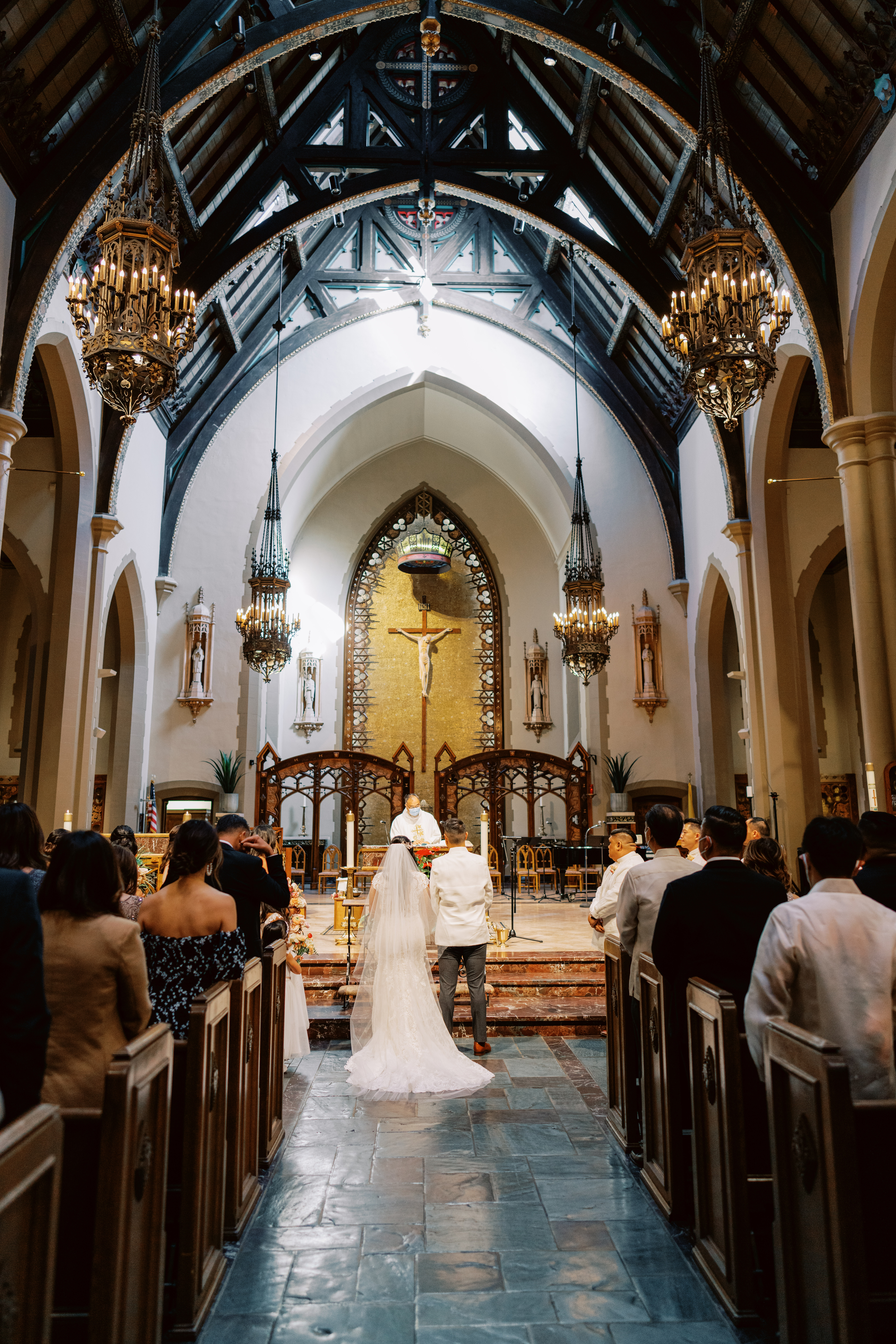 bride and groom at altar in Catholic Church wedding ceremony