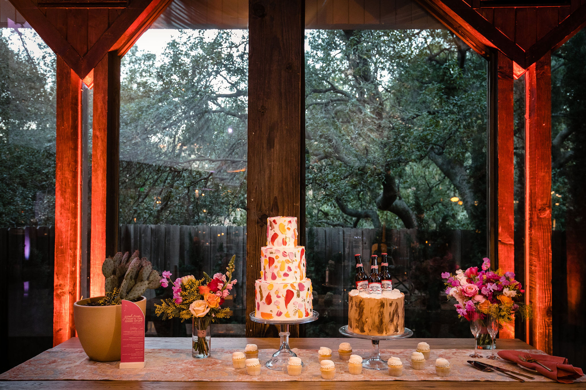 dessert table with beer groom cake and watercolored three tier wedding cake