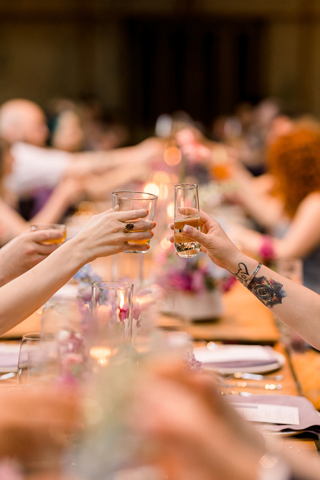 wedding guests cheers during reception 
