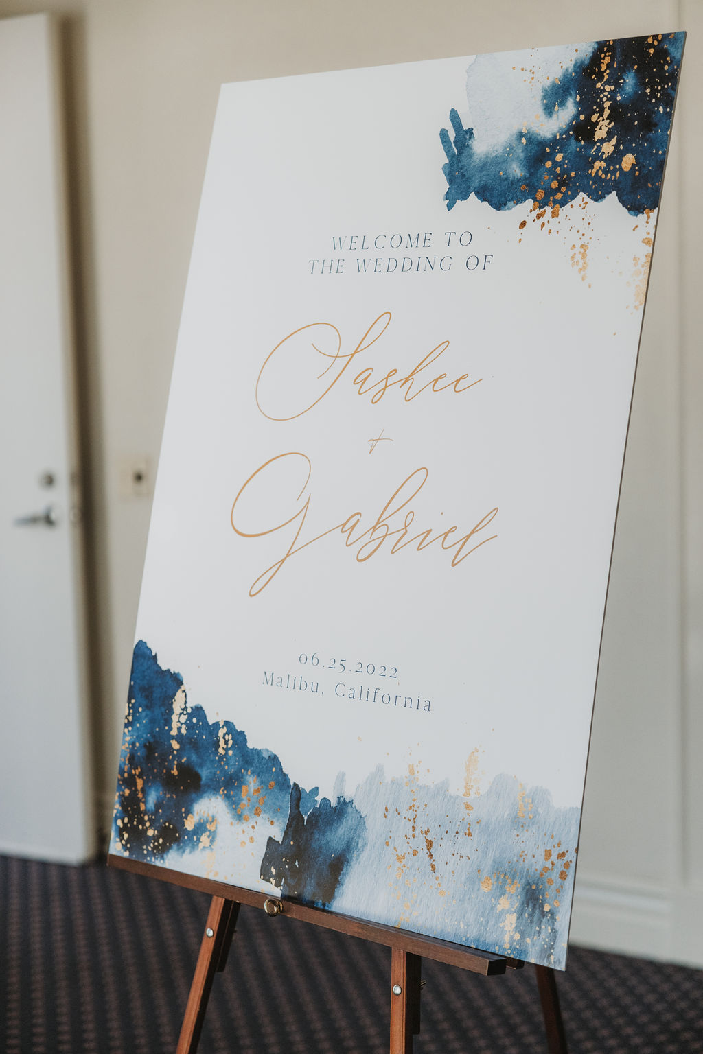 wedding welcome sign with blue watercolors and gold 