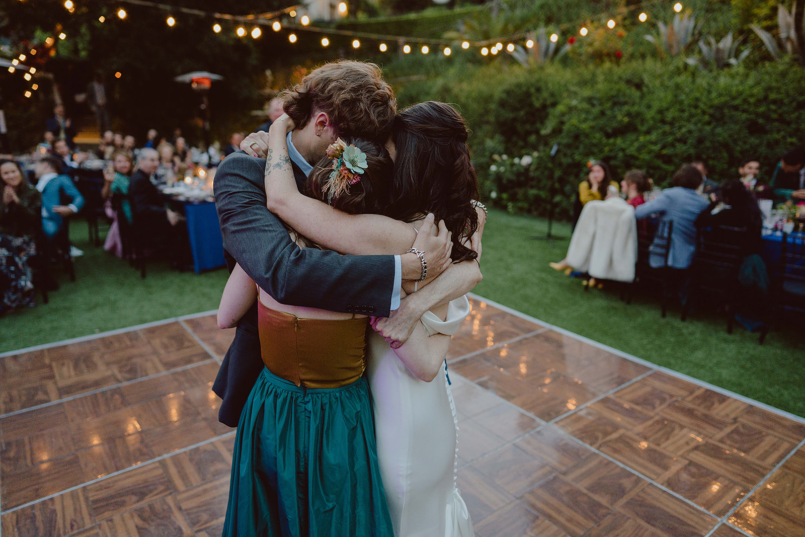 bride dances with friends and family during wedding reception